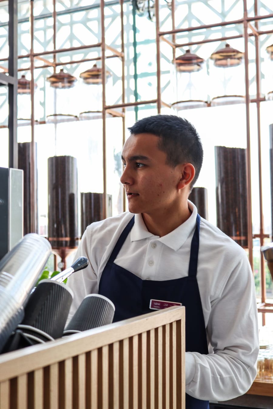 Barista behind the counter of a coffee shop