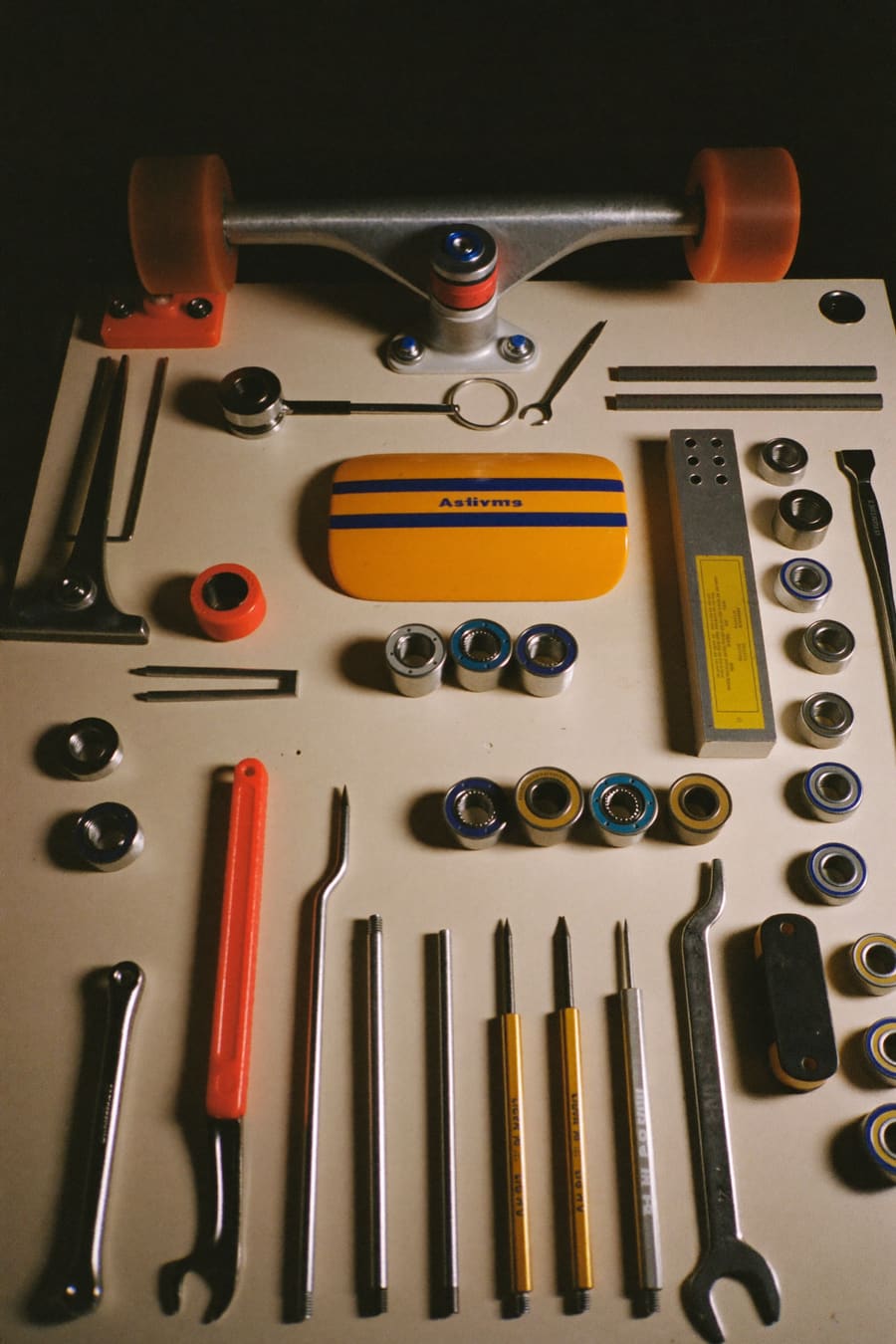 Trucks and tools laid out on a workbench