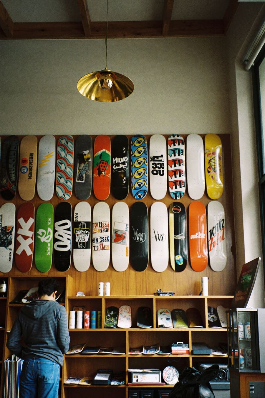 Wall of decks inside the Grind Line Skate Supply shop